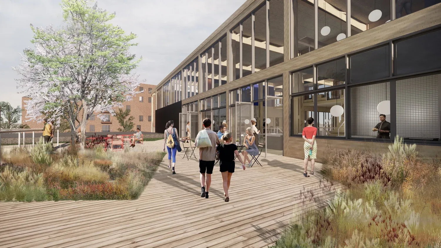 Roskilde Samspil set fra hovedindgangen med transformerede fabrikshaller og nye udendørs opholdsrum